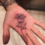 A symbol of love and passion as rose tattoo on the palm in 10 examples
