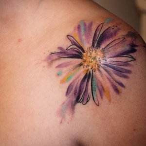 Bright and colorful Aster flower tattoo designs with watercolor effects 1