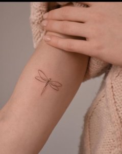 Clean and simple dragonfly tattoo design 1