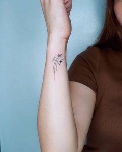 Falling star as elegant shooting star tattoo on wrist 6
