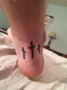 Simple and meaningful three crosses tattoo 6