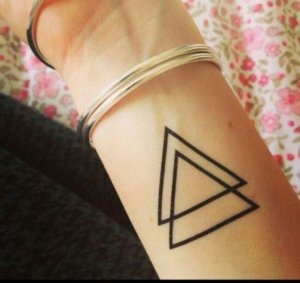 Triangle simple tattoo ideas A symbol of balance and harmony 1