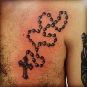10 Rosary chest tattoo ideas to showcase your faith and devotion 9
