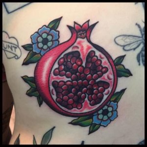 10 pomegranate traditional tattoos Art with symbolic meaning 10
