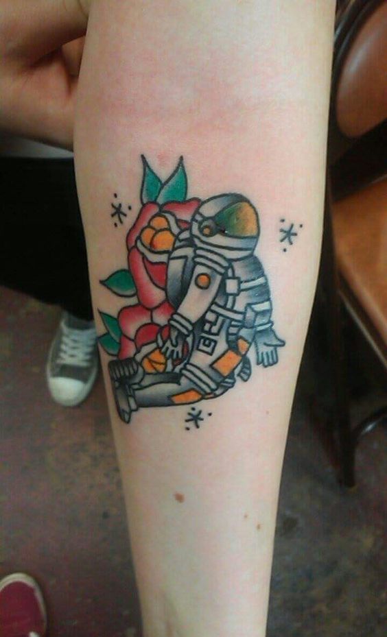 Fly high with these 15 astronaut traditional tattoo designs
