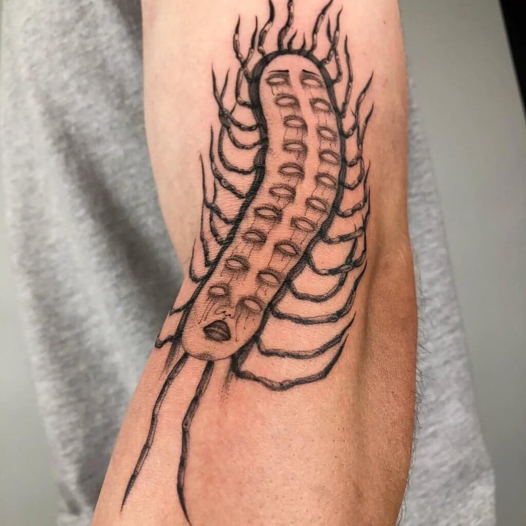 Meaning of abstract Centipede arm Tattoo