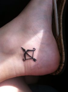 Simple and meaningful Bow and arrow small tattoo ideas 2