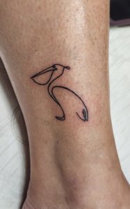 Simple pelican tattoos The beauty of minimalist ink 5