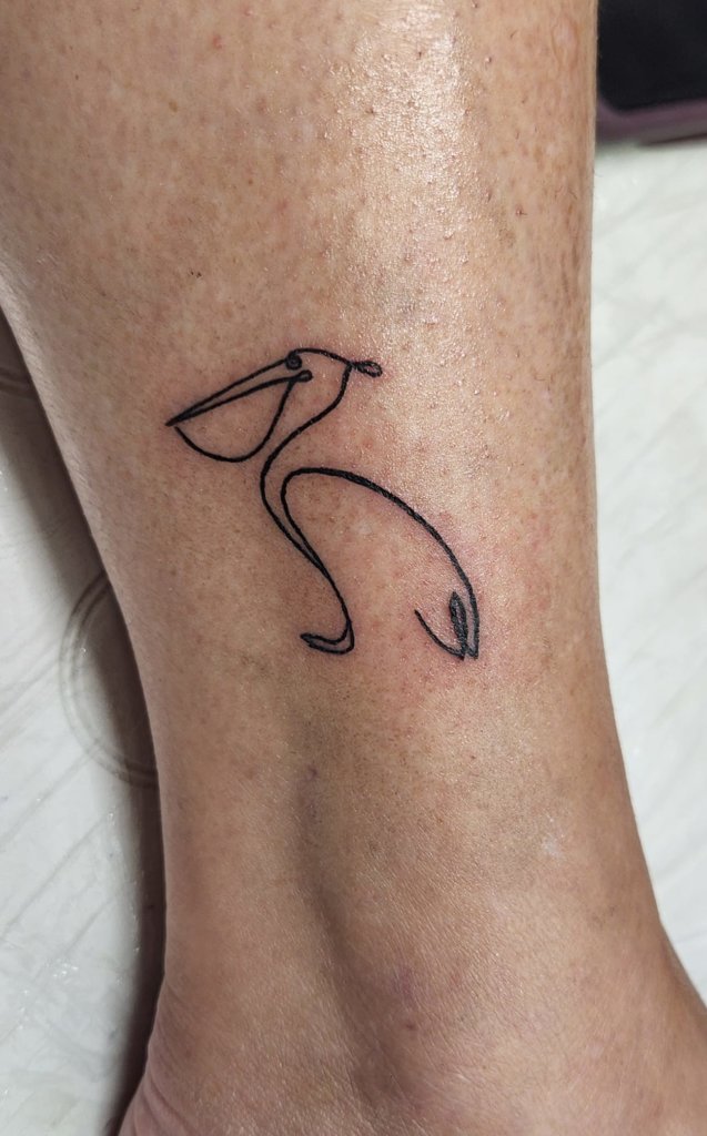 Simple pelican tattoos: The beauty of minimalist ink