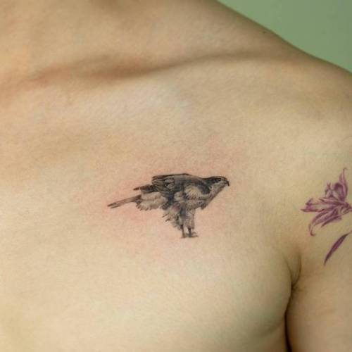 The small falcon tattoo: A perfect choice for minimalist ink
