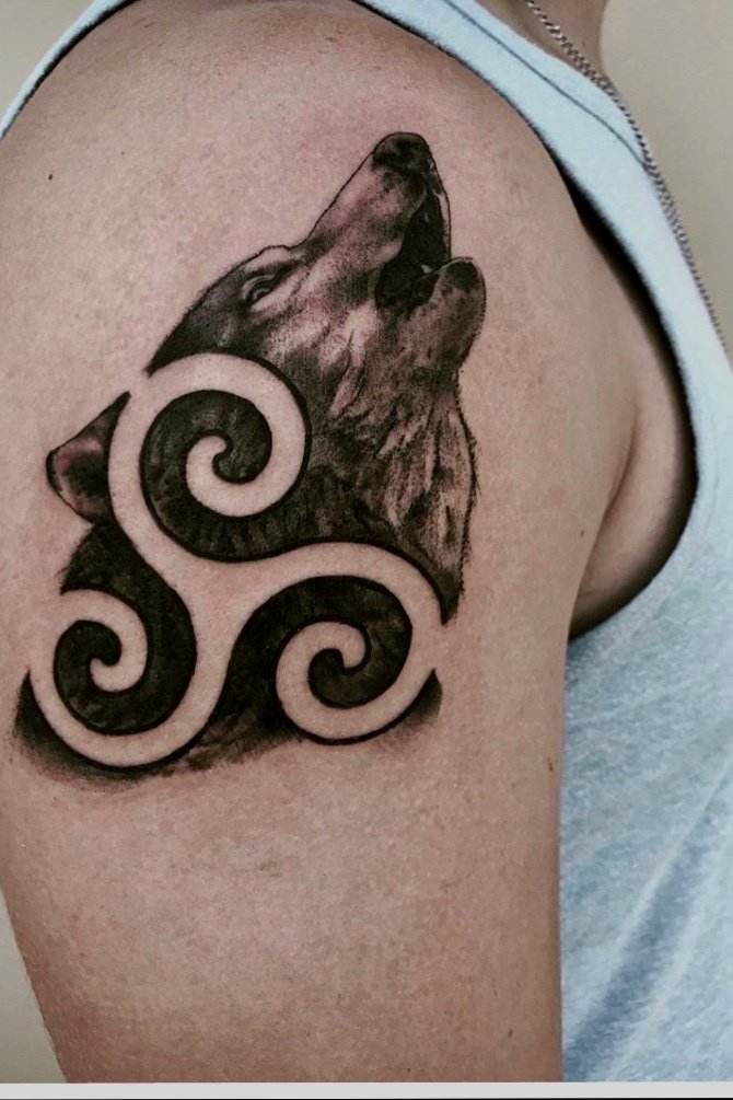Triskele wolf tattoo: A combination of Celtic and animal motifs for your next ink