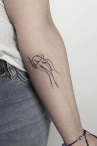 Understated elegance Jellyfish minimalist tattoos 6