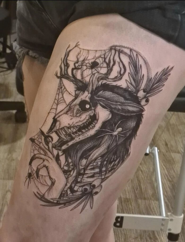 Wendigo thigh tattoo: A beautiful and haunting design