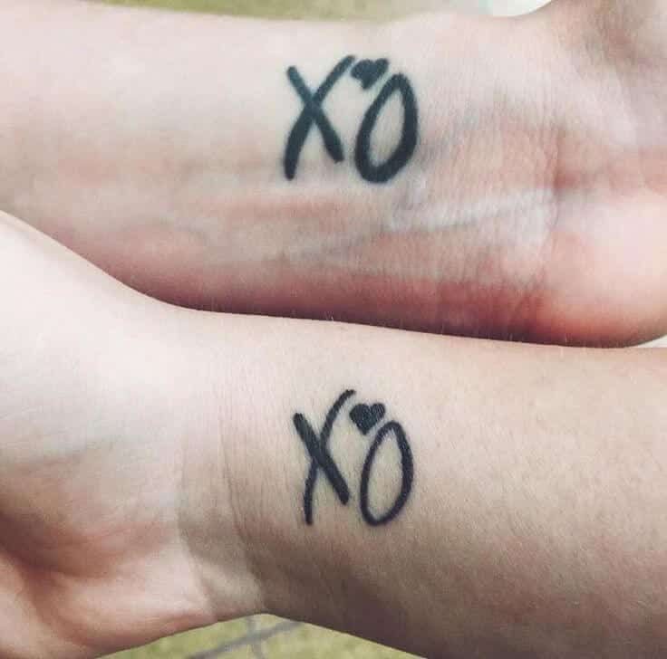 XO wrist tattoo: A sweet and simple expression of love