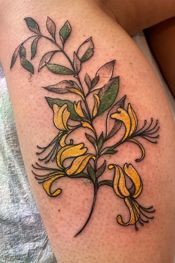Beautiful honeysuckle calf tattoo design representing love, sweet attraction, and the enchanting allure of the honeysuckle flower.