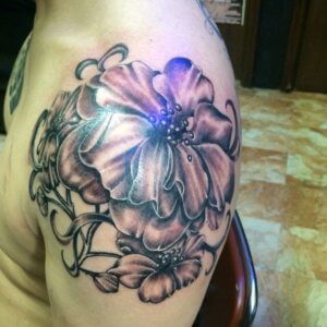 Larkspur Shoulder Tattoo Inspiration Captivating Floral Ink 5