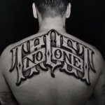 Trust No One lettering men tattoos with deep meaning