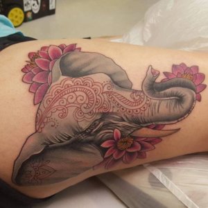 The allure of the elephant inked on the thigh Discover captivating tattoo ideas!