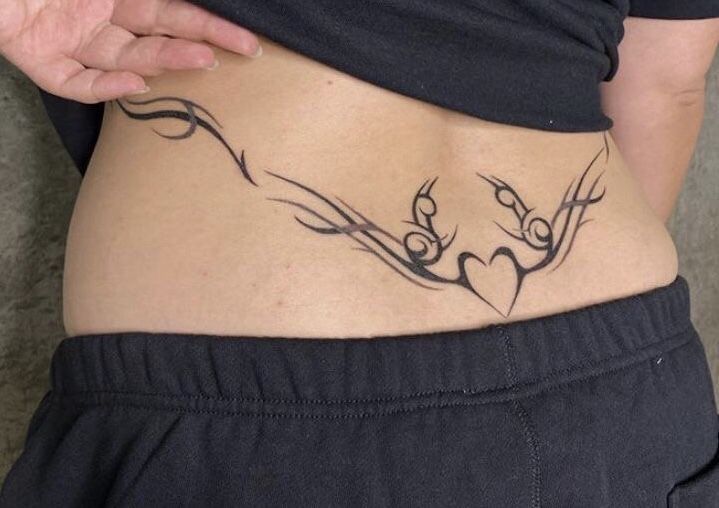 lower back black succubus tattoo